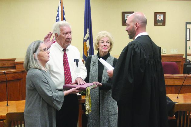 Pictured is Ville Platte City Court Judge Gregory Vidrine (right) as he swears in his father Judge John Larry Vidrine (second from left) as judge on the Third Circuit Court of Appeal to replace the late John Saunders. Also pictured are Melanie Vidrine (left) and Susan Saunders (second from right). (Gazette photo by Tony Marks)